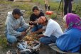 Youth learning how to make caribou hoof rattles.